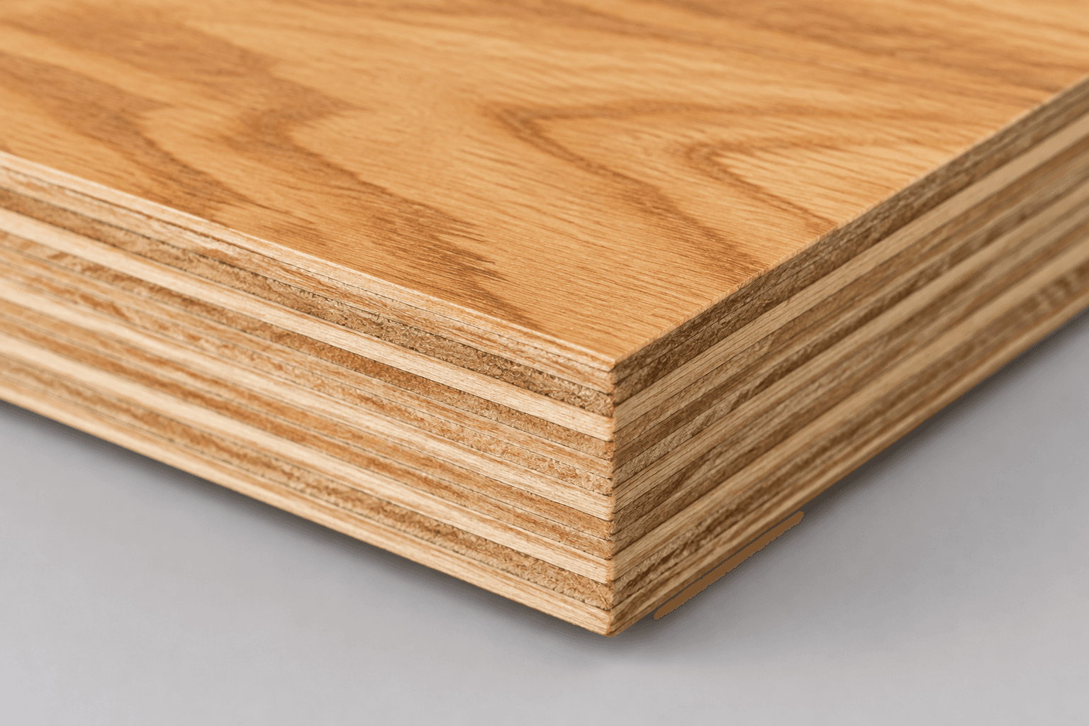 Cut edge of marine-grade BWP plywood showing the cross-laminated plies and glue lines