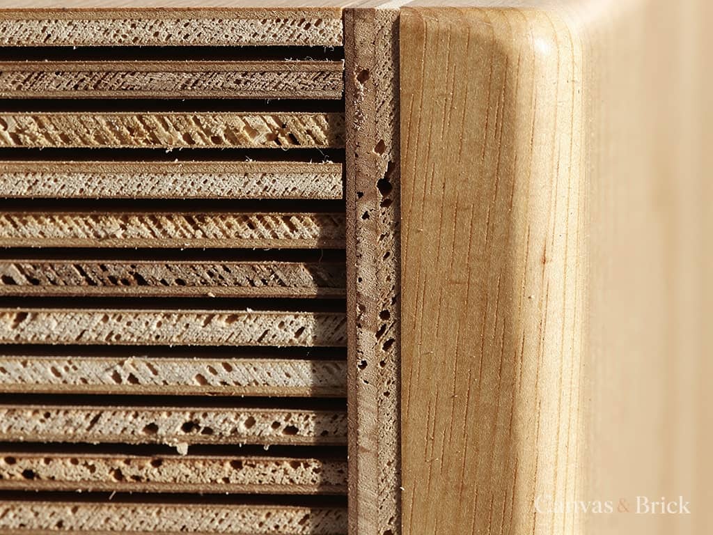 Cut edge of marine-grade BWP plywood showing the cross-laminated plies and glue lines